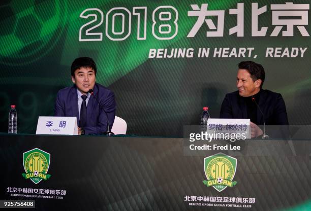 Li Ming , General Manager of Beijing Sinobo Guoan FC and Head coach of Beijing Guoan Roger Schmidt attend a press conference at Worker's Stadium on...