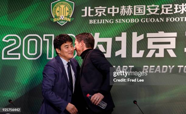 Li Ming , General Manager of Beijing Sinobo Guoan FC and Head coach of Beijing Guoan Roger Schmidt attend a press conference at Worker's Stadium on...