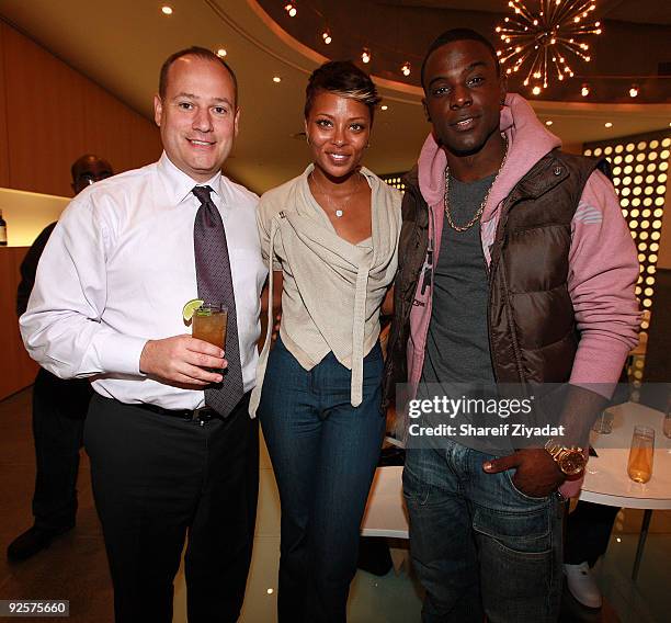 Adam Glaser, Eva Marcille and Lance Gross attend a celebration at the Moet Hennessy USA building on October 30, 2009 in New York City.