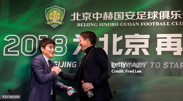 Li Ming , General Manager of Beijing Sinobo Guoan FC and Head coach of Beijing Guoan Roger Schmidt attend a press conference at Worker's Stadium on...