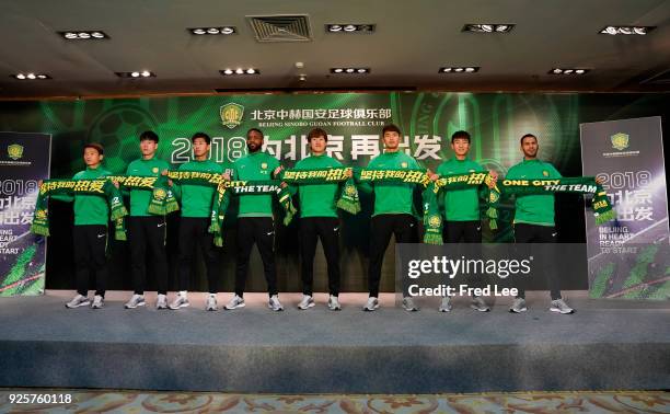 Zhongguo Chi,Huan Liu,Yanqiang Hu,Cedric Bakambu,Wenyi Chi,Ziming Wang,Shihao Wei,Jonathan Viera Ramos of Beijing Guoan FC attend a press conference...