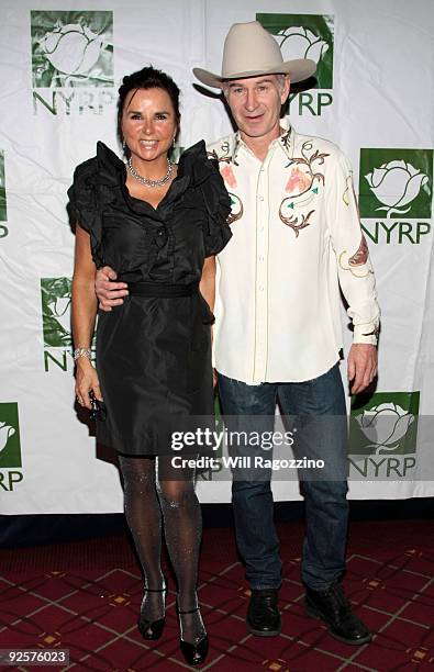 Patti Smyth and John McEnroe attend Bette Midler's New York Restoration Project Annual Hulaween at The Waldorf Astoria Hotel on October 30, 2009 in...