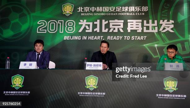 Li Ming , General Manager of Beijing Sinobo Guoan FC and Head coach of Beijing Guoan Roger Schmidt attend a press conference at Worker's Stadium on...