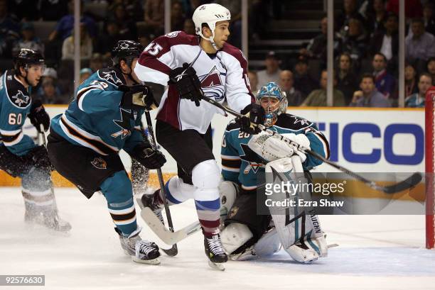 Joe Thornton and goalie Evgeni Nabokov of the San Jose Sharks defend against Chris Durno of the Colorado Avalanche during the first period of their...
