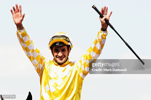 Jockey Corey Brown celebrates after riding Monaco Consul to win the AAMI Victoria Derby during the 2009 Victoria Derby Day meeting at Flemington...