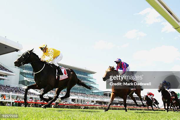 Jockey Corey Brown riding Monaco Consul wins the AAMI Victoria Derby during the 2009 Victoria Derby Day meeting at Flemington Racecourse on October...