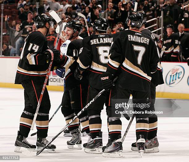 Joffrey Lupul of the Anaheim Ducks is congratulated by teammate Saku Koivu after the final goal of the game on October 30, 2009 at Honda Center in...