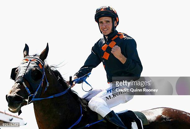 Michael Rodd riding Shocking celebrates winning the Lexus Stakes during the 2009 Victoria Derby Day meeting at Flemington Racecourse on October 31,...