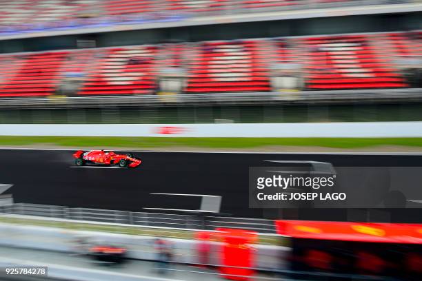 Ferrari's German driver Sebastian Vettel drives at the Circuit de Catalunya on March 1, 2018 in Montmelo on the outskirts of Barcelona during the...