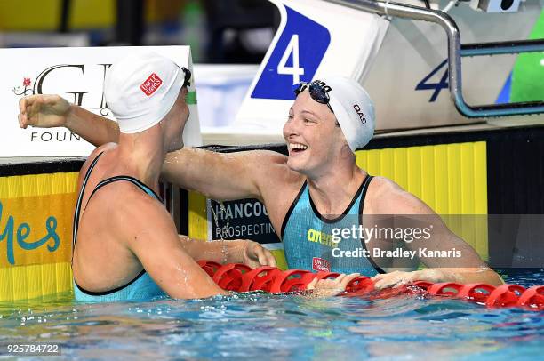 Cate Campbell celebrates with her sister Bronte Campbell after winning the final of the Women's 100m Freestyle event during the 2018 Australia...