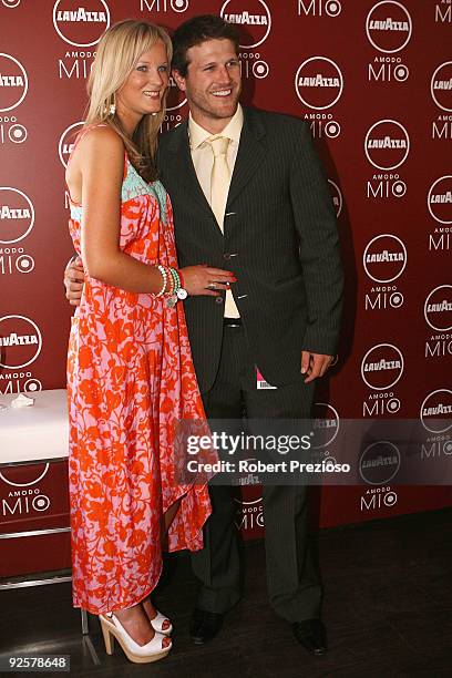 Campbell Brown and partner Jess pose in the Lavazza marquee at the AAMI Victoria Derby Day at Flemington Racecourse on October 31, 2009 in Melbourne,...