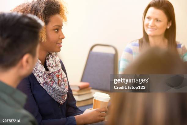 multi-ethnic group counseling session, support meeting. - drug rehab stock pictures, royalty-free photos & images