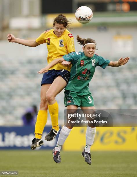 Lyndsay Glohe of the Central Coast Mariners and Kahlia Hogg of Canberra United in action during the round five W-League match between the Central...