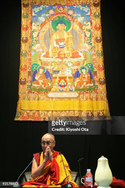 His Holiness the 14th Dalai Lama prays prior to the lecture 'Three Principle Paths and Generating the Altruistic Mind Enlightenment' at Ryogoku...