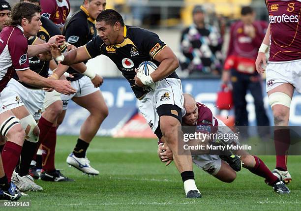 Mathew Luamanu of Wellington is tackled by Jason Rutledge of Southland during the Air New Zealand Cup Semi Final match between Wellington and...