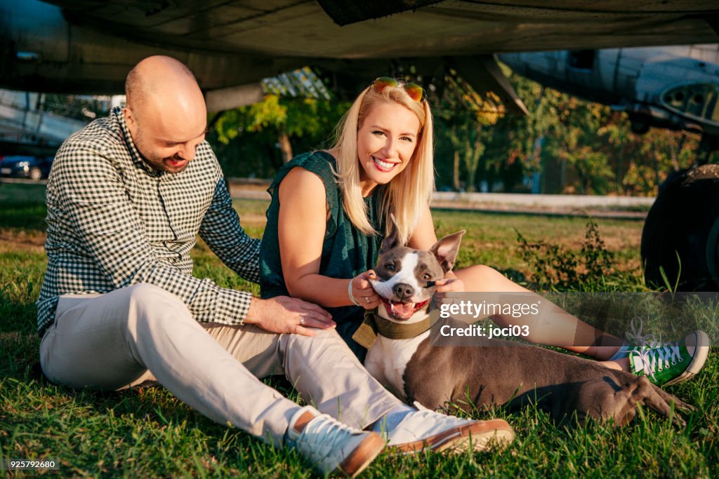 Happy young couple and a pet