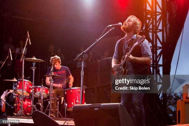 Drummer-producer Pactrick Carney and vocalist-guitarist Dan Auerbach of The Black Keys performs during the pouring rain at the the 2009 Voodoo...