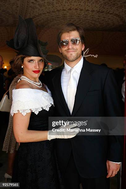 Andrew Gunsberg and Noa Tishby arrive at the Emirates marquee at the AAMI Victoria Derby Day at Flemington Racecourse on October 31, 2009 in...