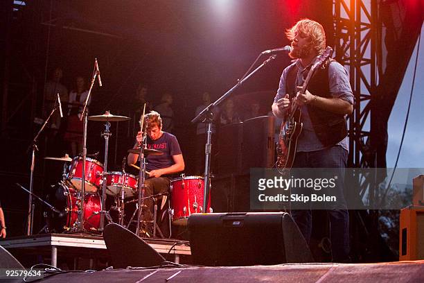 Drummer-producer Pactrick Carney and vocalist-guitarist Dan Auerbach of The Black Keys perform during the pouring rain at the the 2009 Voodoo...