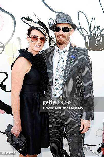 Jason Akermanis and his wife Megan arrive at the Myer marquee at the AAMI Victoria Derby Day at Flemington Racecourse on October 31, 2009 in...