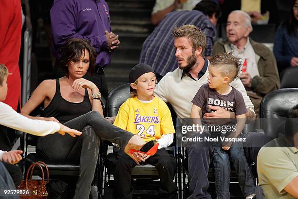 Victoria, Cruz, Romeo and David Beckham attend the Los Angeles Lakers vs Dallas Mavericks game on October 30, 2009 in Los Angeles, California.