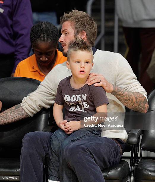 David and Romeo Beckham attends the Los Angeles Lakers vs Dallas Mavericks game on October 30, 2009 in Los Angeles, California.