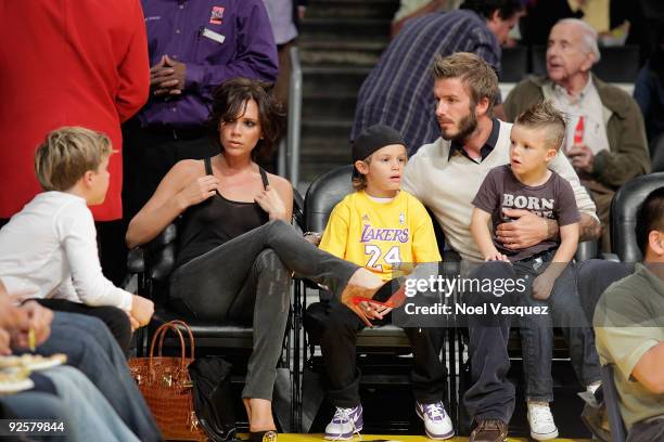 Victoria, Cruz, Romeo and David Beckham attend the Los Angeles Lakers vs Dallas Mavericks game on October 30, 2009 in Los Angeles, California.
