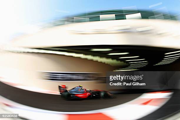 Heikki Kovalainen of Finland and McLaren Mercedes exits the pitlane as he drives during the final practice session prior to qualifying for the Abu...