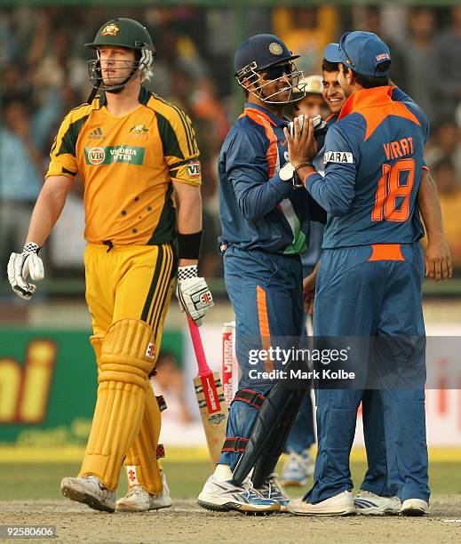 Dhoni of India celebrates after with Ravindra Jadeja after the dismissal of Cameron White of Australia during the third One Day International match...