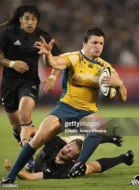 Adam Ashley-Cooper of the Wallabies runs with the ball during the 2009 Bledisloe Cup match between the New Zealand All Blacks and the Australian...