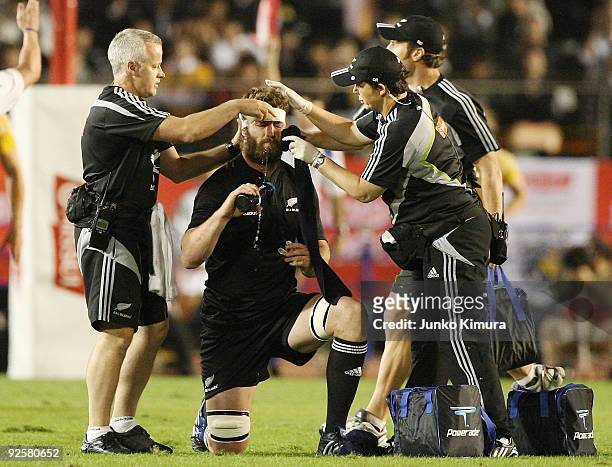 Jason Eaton of the All Blacks receives medical treatment during the 2009 Bledisloe Cup match between the New Zealand All Blacks and the Australian...