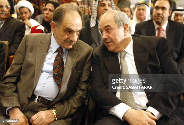 Sunni Muslim politician Saleh al-Mutlak chats with secular Shiite Muslim former Iraqi prime minister Iyad Allawi prior to a press conference...
