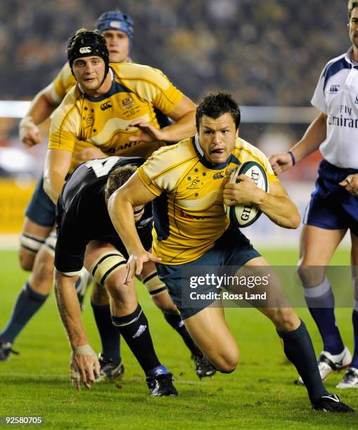 Adam Ashley-Cooper of the Wallabies is tackled during the 2009 Bledisloe Cup match between the New Zealand All Blacks and the Australian Wallabies at...