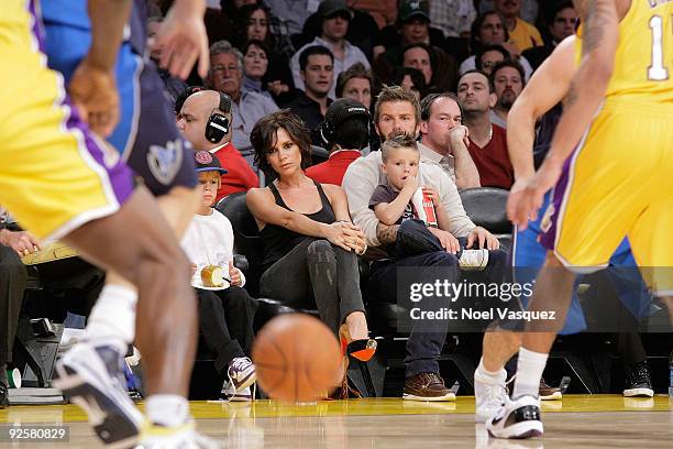 Cruz Beckham, Victoria Beckham, David Beckham and Romeo Beckham attend the Los Angeles Lakers vs Dallas Mavericks game on October 30, 2009 in Los...