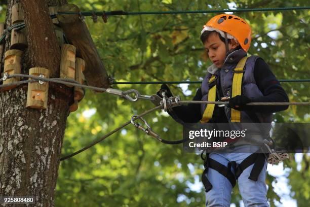 Year-old boy on a rope course. France.