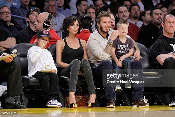 Cruz Beckham, Victoria Beckham, David Beckham and Romeo Beckham attend the Los Angeles Lakers vs Dallas Mavericks game on October 30, 2009 in Los...