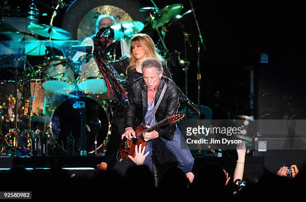Mick Fleetwood, Stevie Nicks and Lindsey Buckingham of Fleetwood Mac perform during their 'Unleashed' tour at Wembley Arena on October 30, 2009 in...