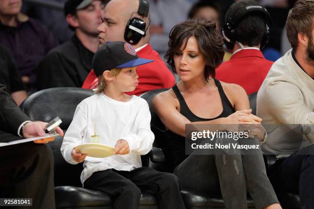 Cruz Beckham and Victoria Beckham attend the Los Angeles Lakers v Dallas Mavericks game on October 30, 2009 in Los Angeles, California.