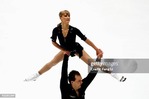 Bronze medalists Tatiana Volosozhar and Stanislav Morozov of Ukraine skate in the Pairs Free Skating during the Cup of China ISU Grand Prix of Figure...
