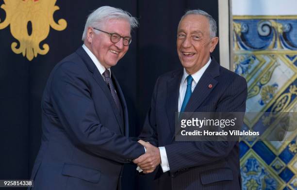 Portuguese President Marcelo Rebelo de Sousa and German President Frank-Walter Steinmeier shake hands and share a laugh before their meeting in Belem...