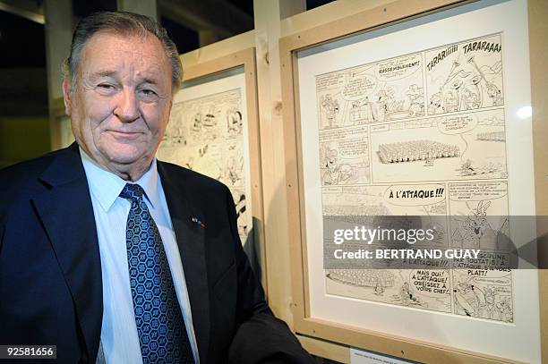 Albert Uderzo, French author and illustrator who launched the Asterix comics strip character with author Rene Goscinny, poses on October 27 next to...