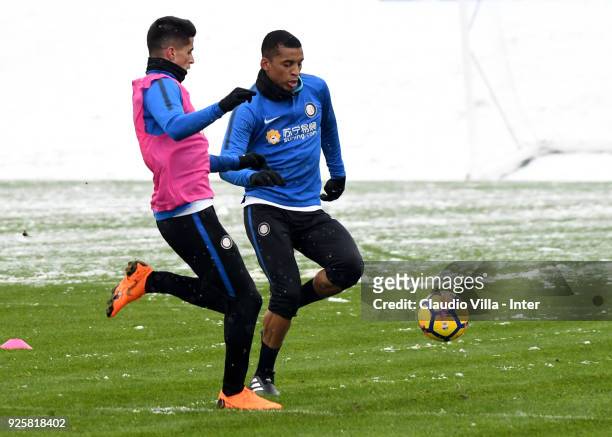 Dalbert Henrique Chagas Estevão and Joao Cancelo of FC Internazionale compete for the ball during the FC Internazionale training session at the...