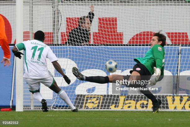 Obafemi Martins of Wolfsburg scores the first goal during the Bundesliga match between VFL Wolfsburg and FSV Mainz 05 at the Volkswagen Arena on...
