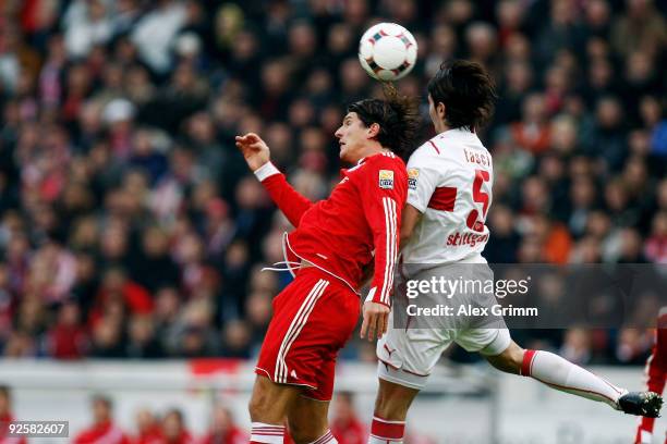 Mario Gomez of Muenchen jumps for a header with Serdar Tasci of Stuttgart during the Bundesliga match between VfB Stuttgart and Bayern Muenchen at...