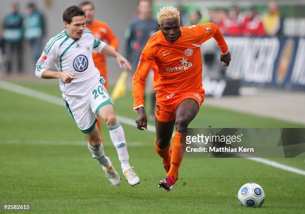 Aristide Bance of Mainz battles for the ball with Sascha Riether of Wolfsburg during the Bundesliga match between VFL Wolfsburg and FSV Mainz 05 at...
