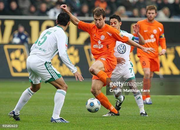 Ricardo Costa, Andreas Ivanschitz and Josue battle for the ball during the Bundesliga match between VFL Wolfsburg and FSV Mainz 05 at the Volkswagen...
