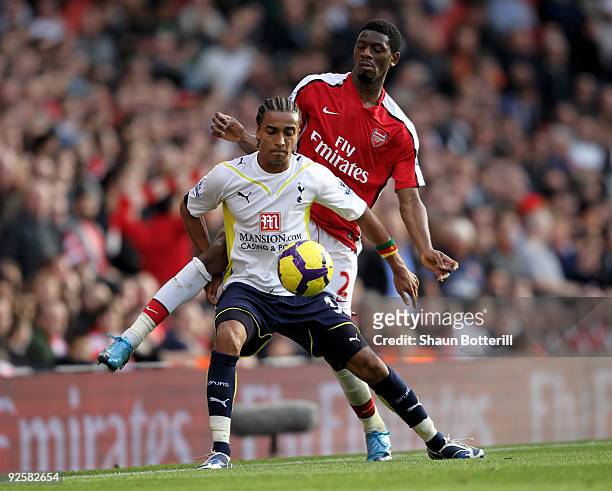 Benoit Assou-Ekotto of Tottenham Hotspur is challenged by Abou Diaby of Arsenal during the Barclays Premier League match between Arsenal and...