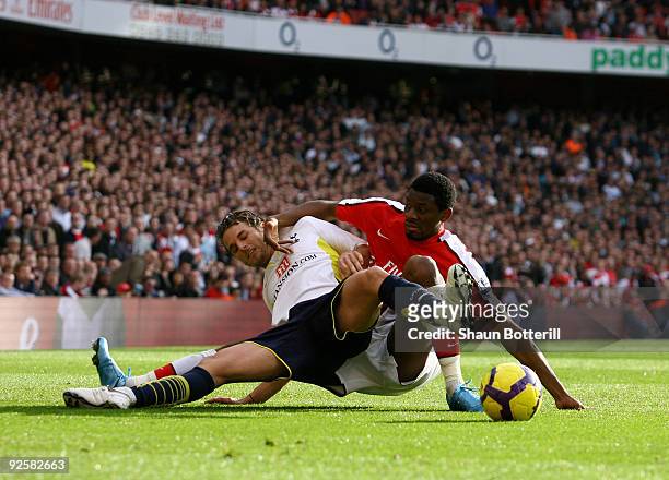 David Bentley of Tottenham Hotspur is challenged by Abou Diaby of Arsenal during the Barclays Premier League match between Arsenal and Tottenham...