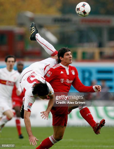 Mario Gomez of Muenchen goes past Serdar Tasci of Stuttgart during the Bundesliga match between VfB Stuttgart and Bayern Muenchen at the...