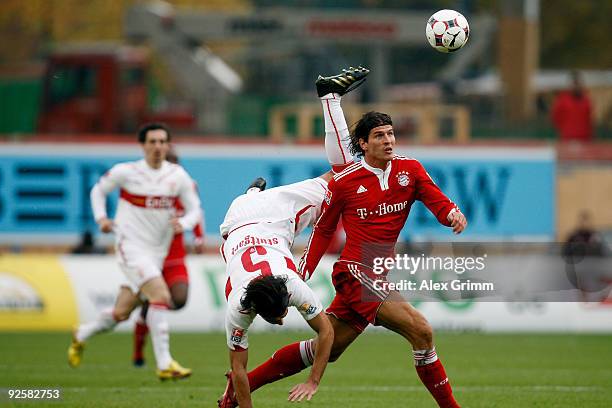 Mario Gomez of Muenchen goes past Serdar Tasci of Stuttgart during the Bundesliga match between VfB Stuttgart and Bayern Muenchen at the...